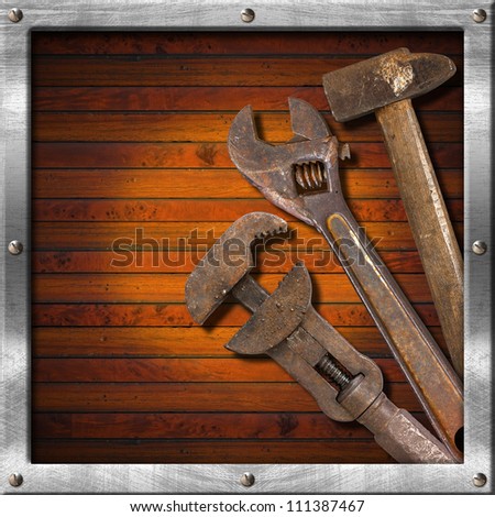 Set of Old Tools on Wood Panel Wood and metal vintage background with old tools and space for text