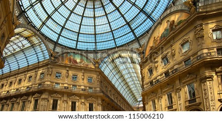 Milan - Vittorio Emanuele II gallery - Italy / Famous shopping center with glass dome and ornaments in Milan Italy