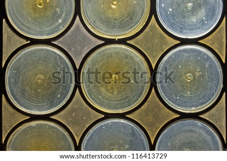 Stained Glass Background / Old window with stained glass - opaque blue and yellow circles