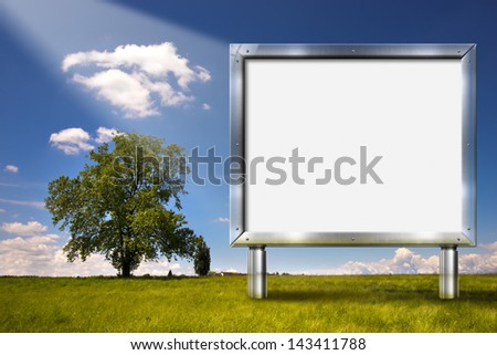 Big Chrome Billboard in the Countryside / Realistic advertising gray chrome billboard in country landscape with big tree