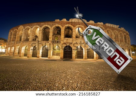 Arena di Verona with Metal Tag / Arena of Verona at night, (UNESCO world heritage site), I-III century - Roman amphitheater with metal tag, steel cable, bolts and text Verona - Italy