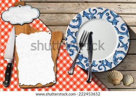 Fish Menu Design / Restaurant fish menu with cutting board, empty label and white paper, empty plate with silver cutlery on wooden background with seashells and checkered tablecloth