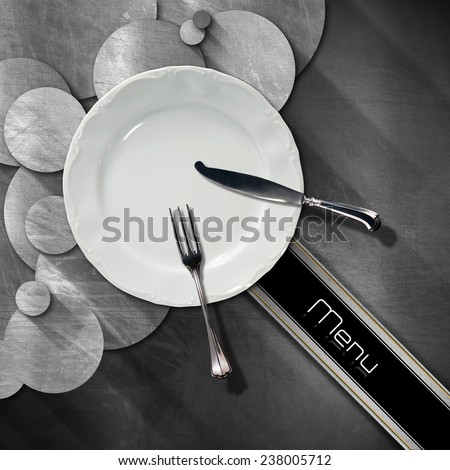 Restaurant Menu Design. Steel stainless background with circles, empty plate and cutlery, diagonal black band with text, menu. Template for a restaurant food menu