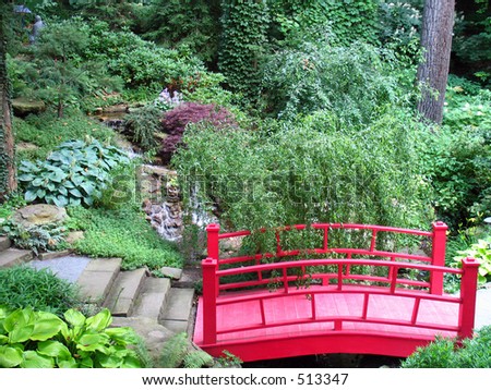 Small Garden Bridges on Ornamental Oriental Garden With Walkway And Red Bridge Stock Photo