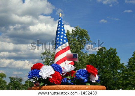 Red, white and blue carnation decoration with American flags