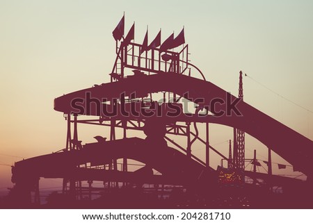 roller coaster at sunset