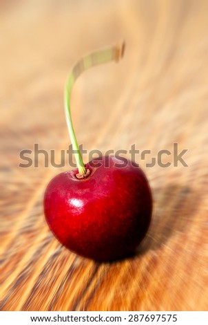 single cherry - blurred style photo