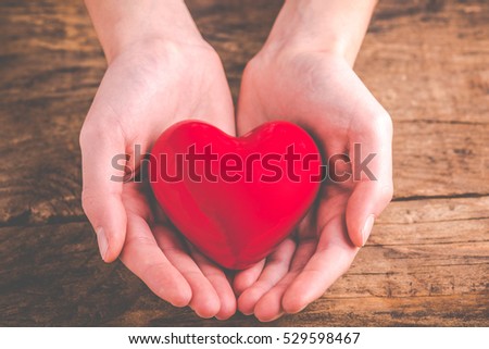 with heart in hands