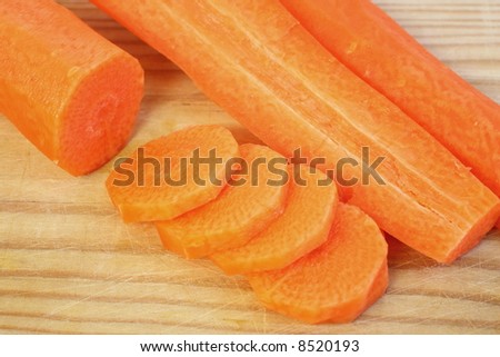 A chopped carrot over a cutting board