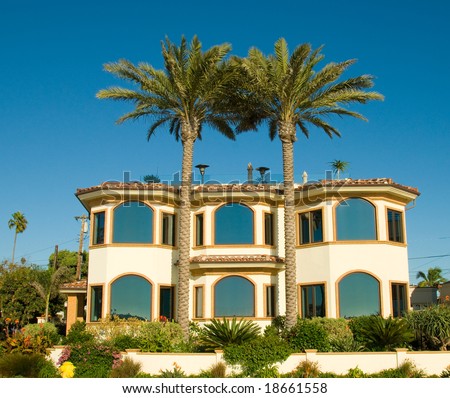 Two Palm Trees in Front of an Ocean View Luxury Estate
