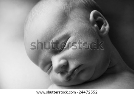 Newborn Baby Boy Sleeping on Mom