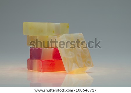close up view of color soap on gray back