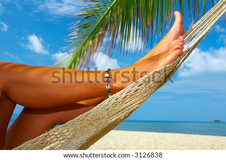 view of nice smooth woman’s legs in tropical bliss