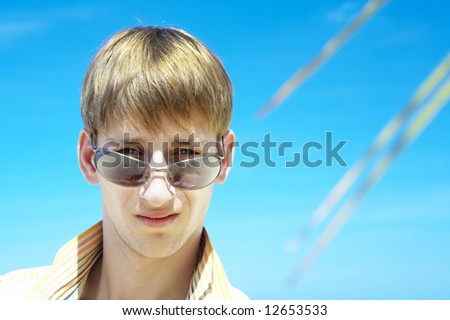 Portrait of young gorgeous male in outdoor environment