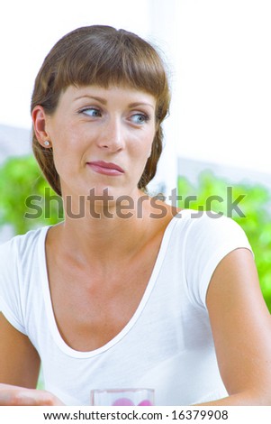 High key portrait of nice young woman  in summer environment