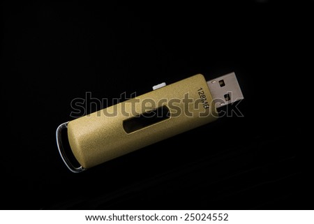 Close up view of usb flash drive on black back
