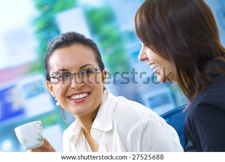 Portrait of young pretty women having coffee break in office environment