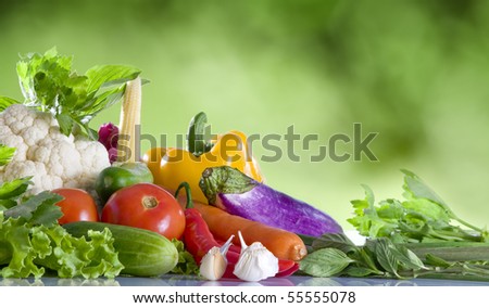 Close up view of nice fresh vegetables  on green summer back