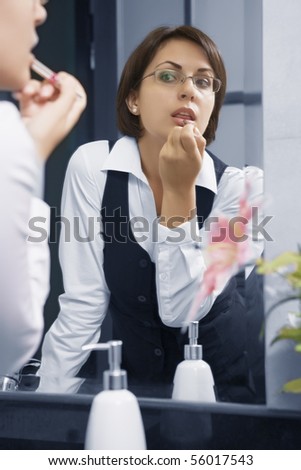 Portrait of young pretty  businesswoman in ladies room environment