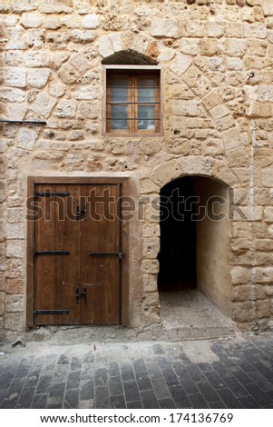 Limestone wall with doors and windows in ancient city Saida, Lebanon