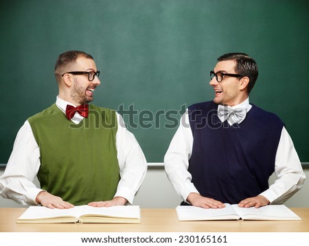 Two male nerds shaking hands