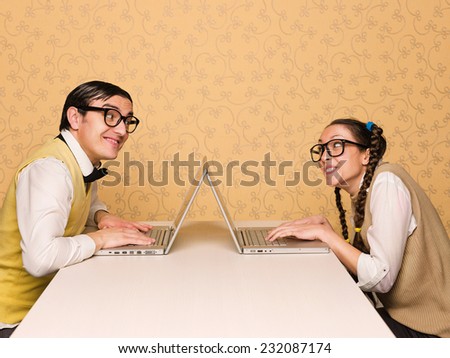 Young nerds sitting at the desk