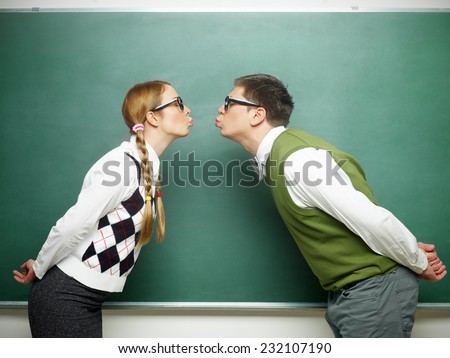 Nerd couple kissing