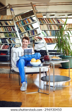 Man relaxing with digital tablet