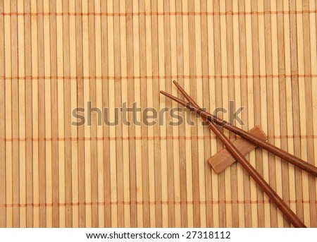 Wooden mat and eating sticks
