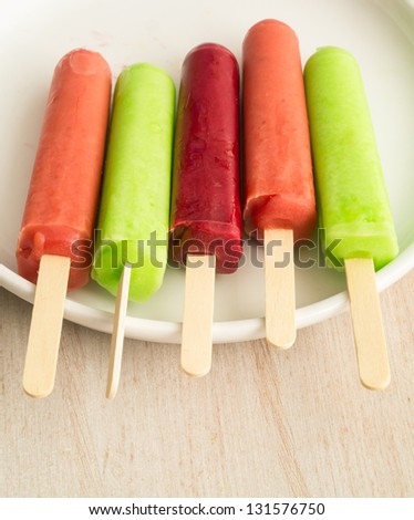 A row of colorful fruit ice pops