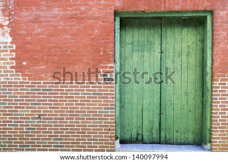 Old weathered factory door background.