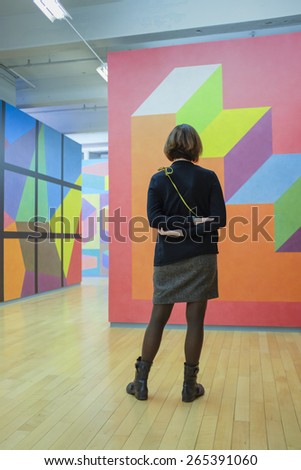 NORTH ADAMS, MA  MARCH 18th: Woman looking at modern art at MassMoCA art museum in North Adams, MA on March 18th, 2015