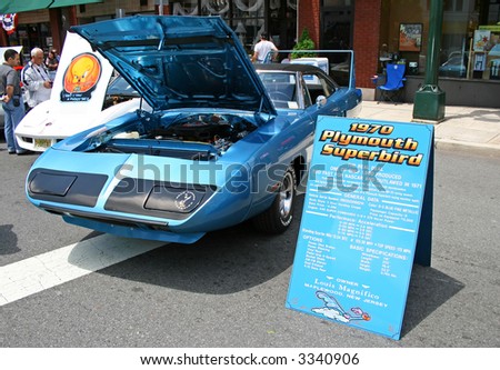 A classic car displayed at a street antique car show