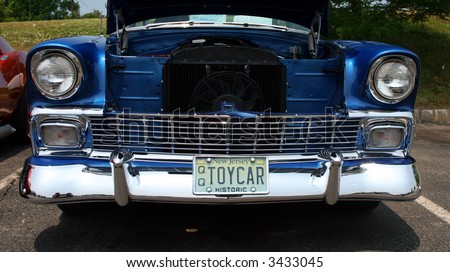 A classic car displayed at a street antique car show