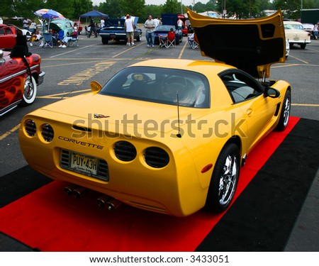 A classic car displayed at a street antique car show - The Corvette