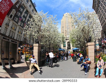 NEW YORK CITY- APRIL 17 : A fisheye view of people enjoy sunny spring days at the Herald Square in midtown Manhattan April 17, 2009 in New York.