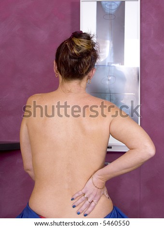 Woman indicating back pain