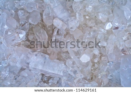 Blue quartz crystal shapes form abstract patterns.