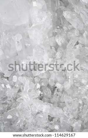 White and amber quartz crystal shapes form abstract patterns.