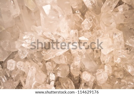 Amber quartz crystal shapes form abstract patterns.