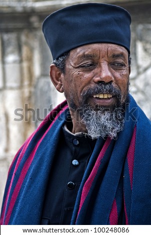 JERUSALEM - APRIL 14 : Ethiopian Orthodox priest await the start of the Holy fire ceremony at the Ethiopian section of the Holy Sepulcher on April 14, 2012 in Jerusalem, Israel