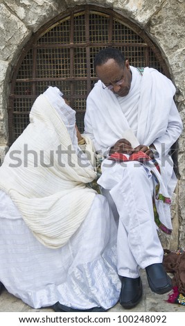 JERUSALEM - APRIL 14 : Ethiopian Orthodox worshipers await the start of the Holy fire ceremony at the Ethiopian section of the Holy Sepulcher on April 14, 2012 in Jerusalem, Israel