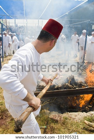 NABLUS , PALESTINIAN TERRITORY - MAY 04 : Member of the ancient Samaritan community during the traditional Passover sacrifice in Mount Gerizim near the west bank city of Nablus on May 04 2012