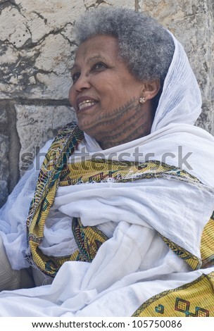 JERUSALEM - APRIL 14 : Ethiopian Orthodox worshiper await the start of the Holy fire ceremony at the Ethiopian section of the Holy Sepulcher in Jerusalm Israel on April 14 2012