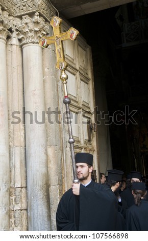 JERUSALEM - APRIL 13 : Greek Orthodox monk carry across at the Church of the Holy Sepulchre in Jerusalem Israel during Good Friday on April 13 2012