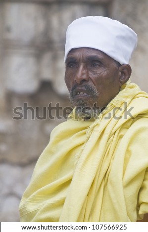 JERUSALEM - APRIL 14 : Ethiopian Orthodox worshiper await the start of the Holy fire ceremony at the Ethiopian section of the Holy Sepulcher in Jerusalm Israel on April 14 2012
