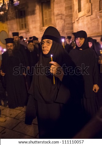 JERUSALEM - AUGUST 25 : Unidentified nuns take part in a candle procession as part of the feast of the Assumption of the Virgin Mary on August 25, 2012 in old Jerusalem, Israel