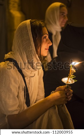JERUSALEM - AUGUST 25 : Unidentified pilgrims take part in a candle procession as part of the feast of the Assumption of the Virgin Mary on August 25 2012 in old Jerusalem Israel