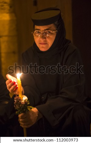 JERUSALEM - AUGUST 25 : Unidentified nun take part in a candle procession as part of the feast of the Assumption of the Virgin Mary on August 25 2012 in old Jerusalem Israel
