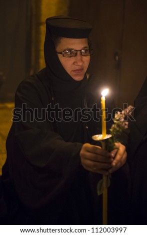 JERUSALEM - AUGUST 25 : Unidentified nun take part in a candle procession as part of the feast of the Assumption of the Virgin Mary on August 25 2012 in old Jerusalem Israel